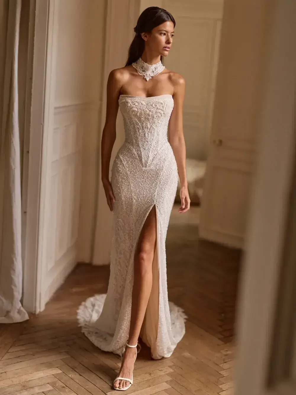 model is wearing a strapless fit and flare bridal gown