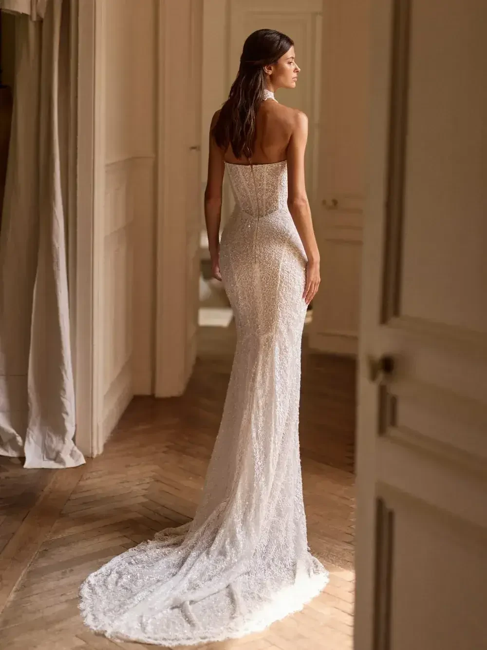 model is wearing a strapless fit and flare bridal gown