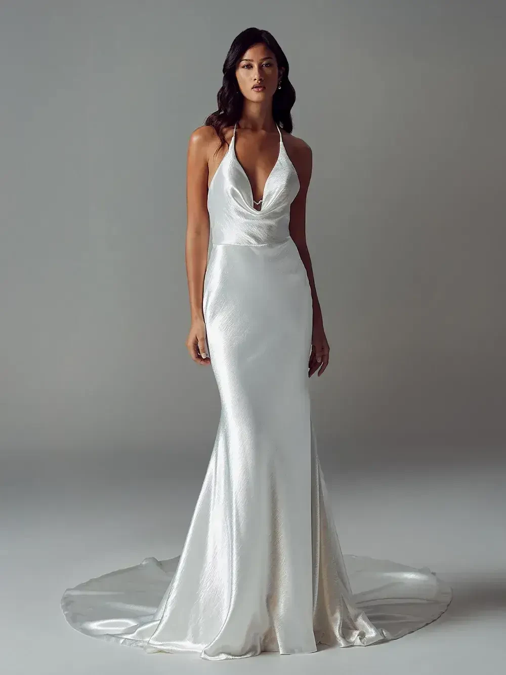 model is wearing a sleeveless fit and flare bridal gown