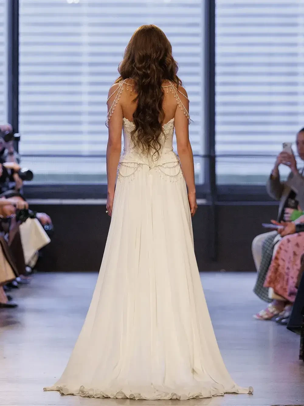 model is wearing a structured basque waist wedding gown