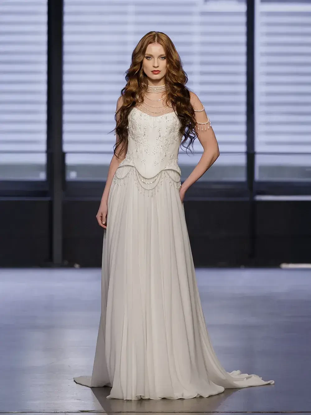model is wearing a structured basque waist wedding gown