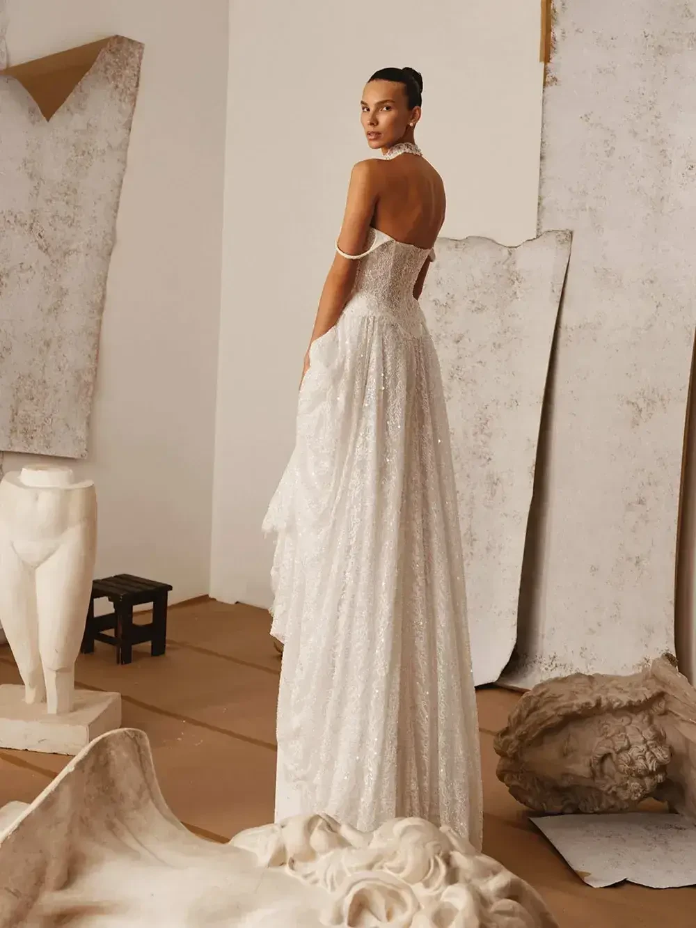 model is wearing a strapless a-line wedding gown