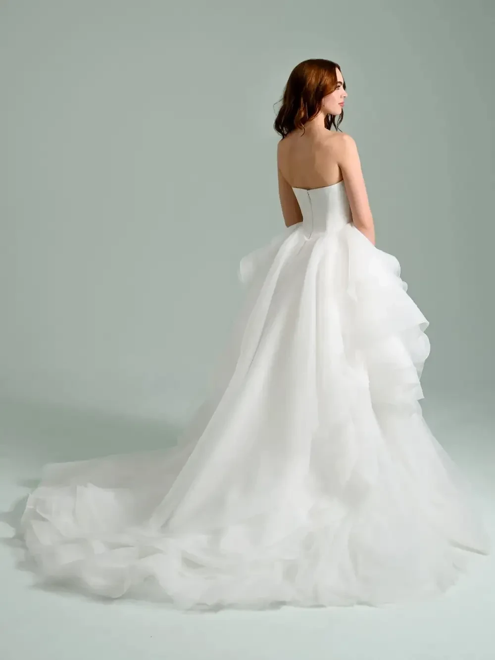 model is wearing a strapless bridal gown